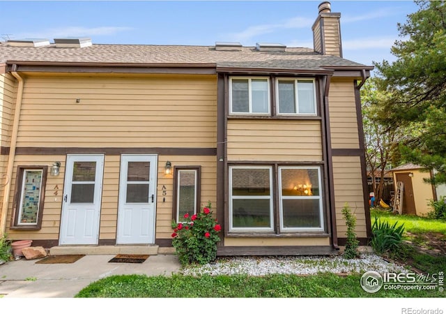 985 W 10th St Unit A5, Loveland, CO 80537 - view of front facade with a chimney
