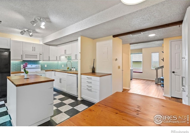 985 W 10th St Unit A5, Loveland, CO 80537 - kitchen with wood counters, white appliances, a sink, a textured ceiling, and dark floors