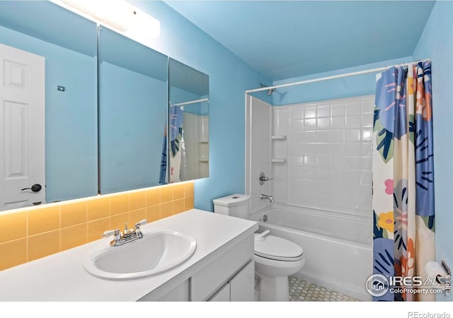 985 W 10th St Unit A5, Loveland, CO 80537 - full bathroom featuring vanity, toilet, shower / bathtub combination with curtain, tasteful backsplash, and tile patterned flooring