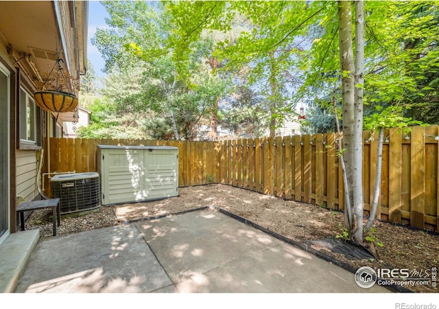 985 W 10th St Unit A5, Loveland, CO 80537 - fenced backyard featuring central AC and a patio area