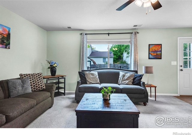 1309 Red Mountain Dr, Longmont, CO 80504 - living area featuring carpet flooring and a ceiling fan