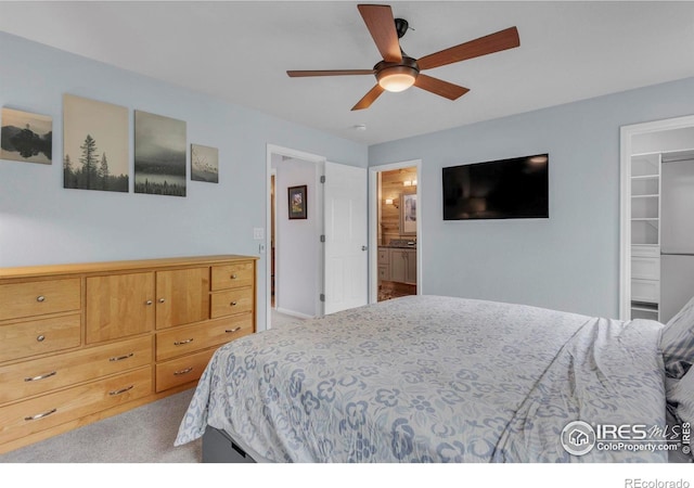 1309 Red Mountain Dr, Longmont, CO 80504 - bedroom with carpet flooring, a spacious closet, connected bathroom, and ceiling fan