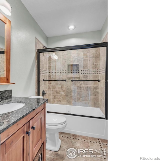 1309 Red Mountain Dr, Longmont, CO 80504 - full bathroom featuring vanity, shower / bath combination with glass door, and recessed lighting