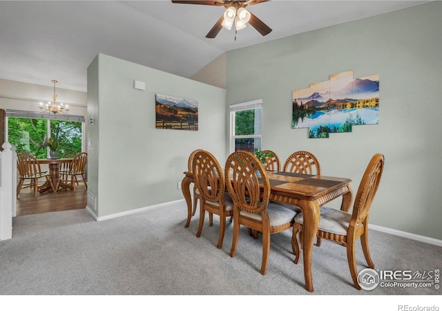 1309 Red Mountain Dr, Longmont, CO 80504 - dining room featuring a chandelier, carpet flooring, healthy amount of natural light, ceiling fan, and vaulted ceiling