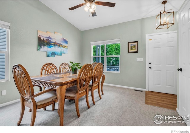 1309 Red Mountain Dr, Longmont, CO 80504 - dining room featuring light carpet, ceiling fan, and a chandelier