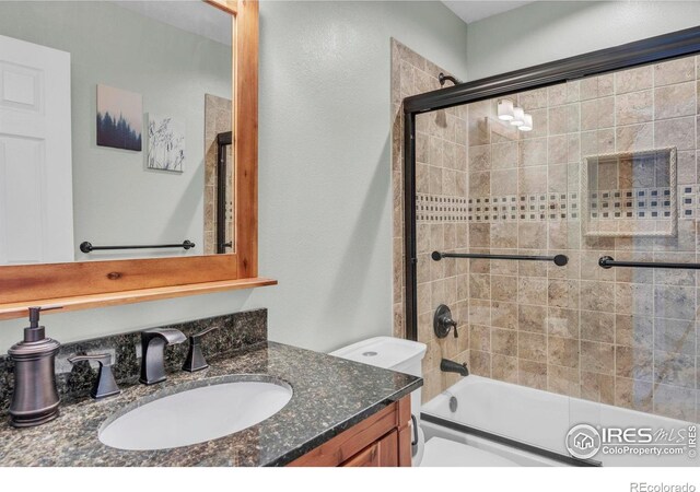 1309 Red Mountain Dr, Longmont, CO 80504 - full bathroom featuring combined bath / shower with glass door and vanity