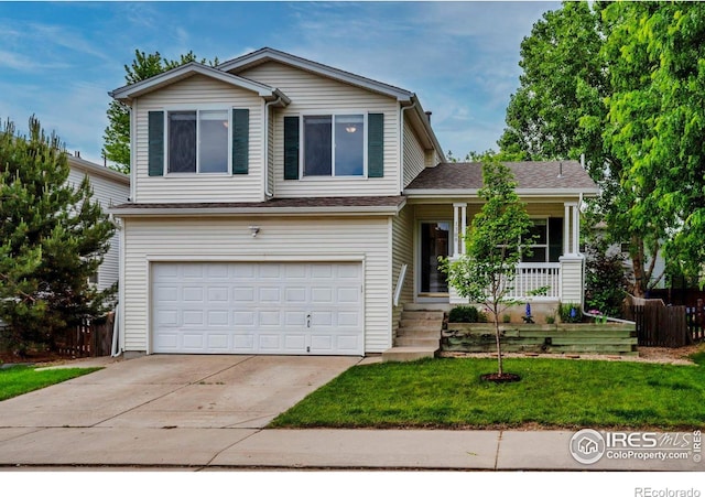 1309 Red Mountain Dr, Longmont, CO 80504 - split level home with a porch, a garage, and driveway