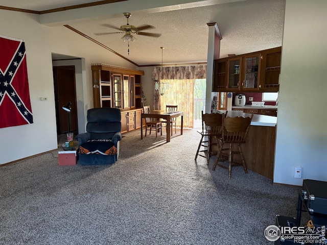 507 Ellis Ave, Wray, CO 80758 - dining area featuring carpet floors, a ceiling fan, ornamental molding, and vaulted ceiling