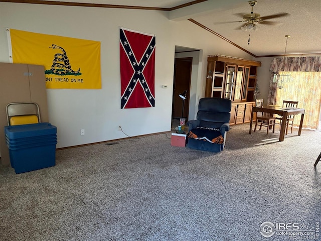 507 Ellis Ave, Wray, CO 80758 - living area featuring vaulted ceiling, carpet, ceiling fan, crown molding, and baseboards