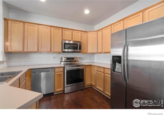 2202 Owens Ave # 102, Fort Collins, CO 80528 - kitchen with appliances with stainless steel finishes, light brown cabinetry, recessed lighting, dark wood-style floors, and a sink