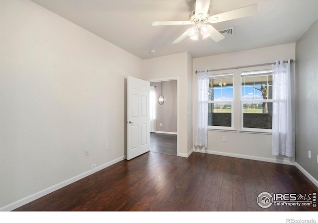2202 Owens Ave # 102, Fort Collins, CO 80528 - spare room featuring wood-type flooring, ceiling fan, and baseboards