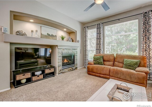 6208 Treestead Ct, Fort Collins, CO 80528 - living room featuring carpet, a ceiling fan, a fireplace, and baseboards