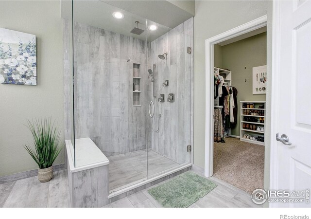 6208 Treestead Ct, Fort Collins, CO 80528 - bathroom featuring a shower stall, a spacious closet, and recessed lighting