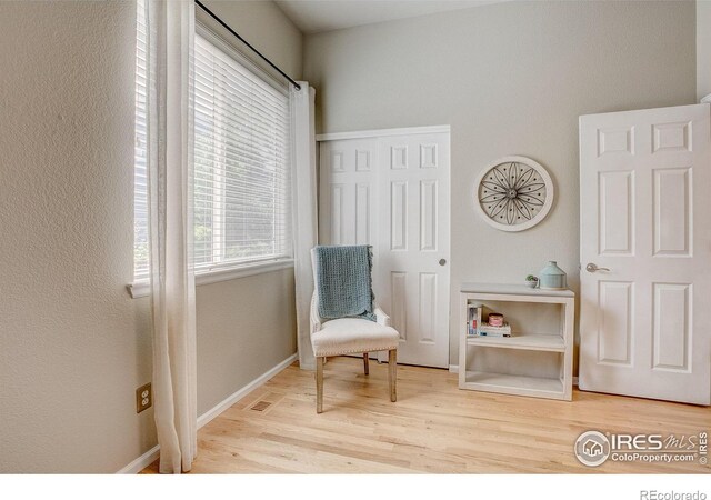 6208 Treestead Ct, Fort Collins, CO 80528 - living area featuring wood finished floors and baseboards