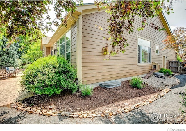 6208 Treestead Ct, Fort Collins, CO 80528 - view of side of home with a patio area