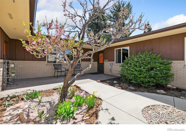 1204 Newsom St, Fort Collins, CO 80524 - property entrance featuring brick siding and board and batten siding