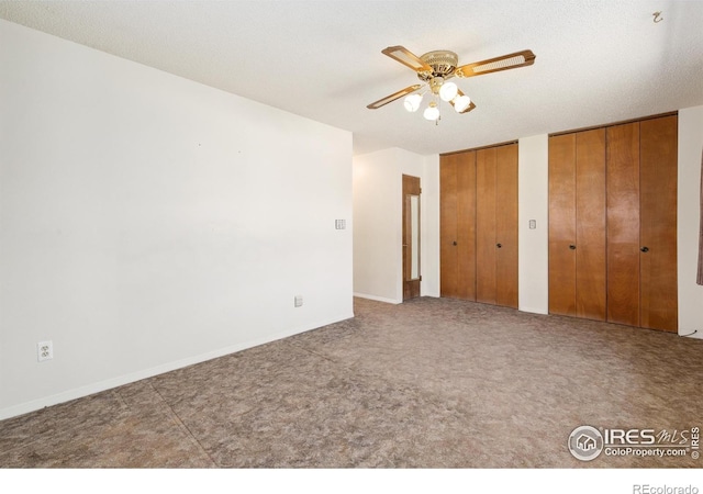 1204 Newsom St, Fort Collins, CO 80524 - unfurnished bedroom with two closets, carpet, and a ceiling fan