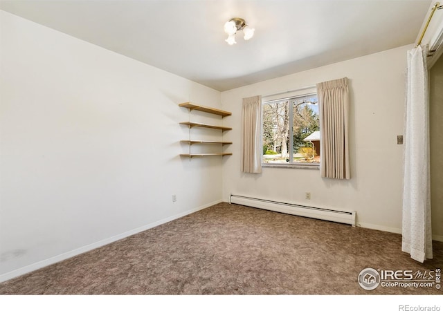 1204 Newsom St, Fort Collins, CO 80524 - spare room featuring a baseboard heating unit, carpet, and baseboards