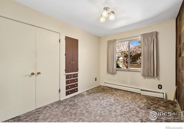 1204 Newsom St, Fort Collins, CO 80524 - unfurnished bedroom with a baseboard radiator, carpet floors, and a closet