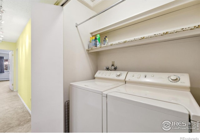 1204 Newsom St, Fort Collins, CO 80524 - laundry room with carpet, washer and clothes dryer, baseboard heating, and baseboards