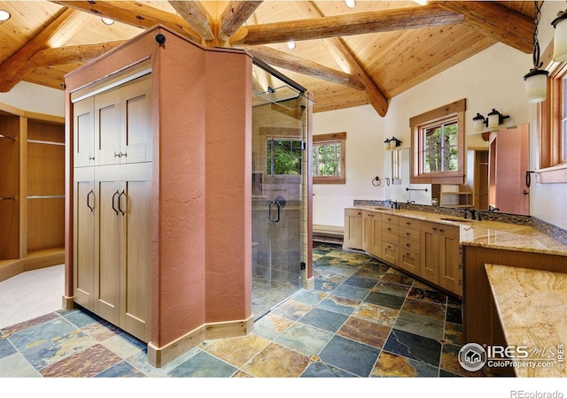409 Wild Horse Cir, Boulder, CO 80304 - bathroom with a wooden ceiling with exposed beams, stone tile floors, a shower stall, and double vanity