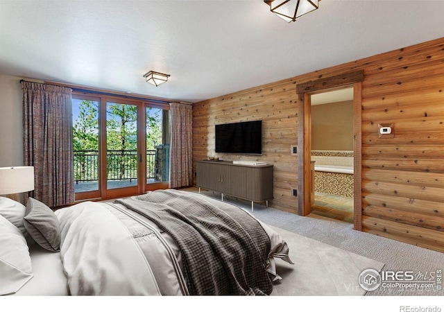 409 Wild Horse Cir, Boulder, CO 80304 - carpeted bedroom featuring wood walls and access to exterior