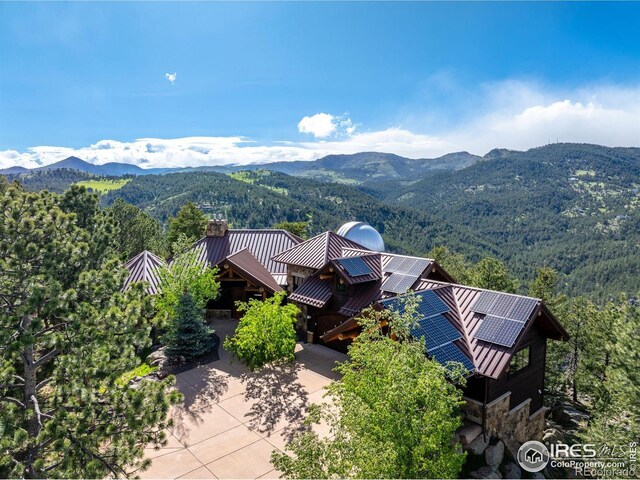 409 Wild Horse Cir, Boulder, CO 80304 - view from above of property with a mountainous background and a forest