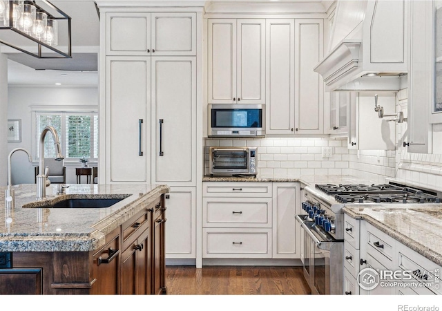 3835 Norwood Ct, Boulder, CO 80304 - kitchen with stainless steel appliances, a sink, custom range hood, dark wood-style floors, and decorative backsplash