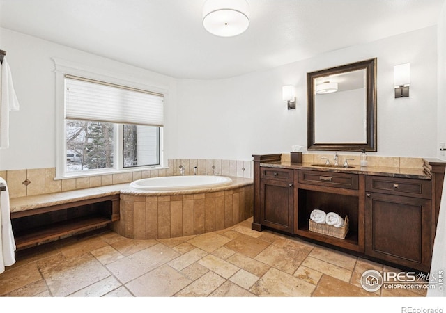 3835 Norwood Ct, Boulder, CO 80304 - bathroom with stone tile floors, vanity, and a bath