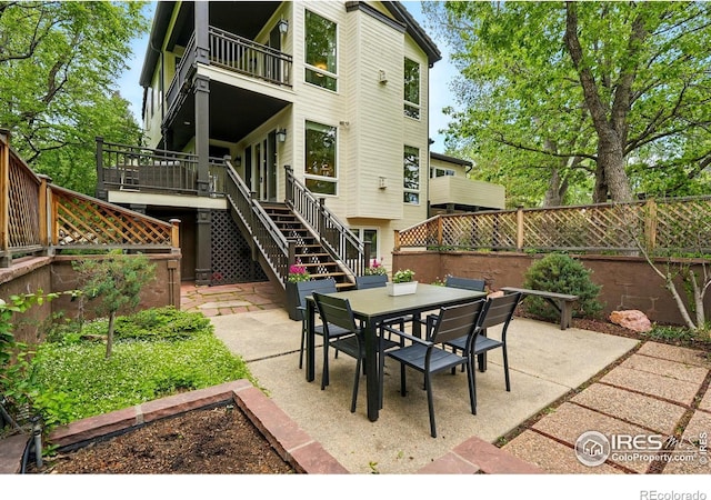 3835 Norwood Ct, Boulder, CO 80304 - view of patio / terrace with stairs, outdoor dining area, and a balcony