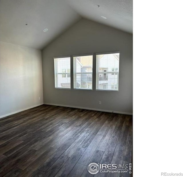 539 Vicot Way Unit C, Fort Collins, CO 80524 - empty room featuring vaulted ceiling, dark wood finished floors, and baseboards