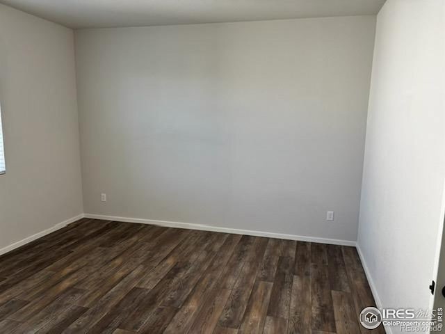 539 Vicot Way Unit C, Fort Collins, CO 80524 - unfurnished room featuring dark wood-type flooring and baseboards