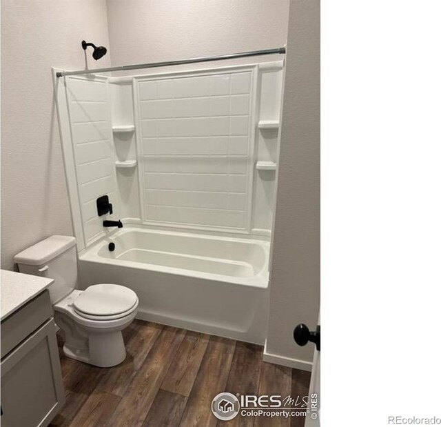 539 Vicot Way Unit C, Fort Collins, CO 80524 - full bathroom with vanity, wood finished floors, tub / shower combination, toilet, and a textured wall