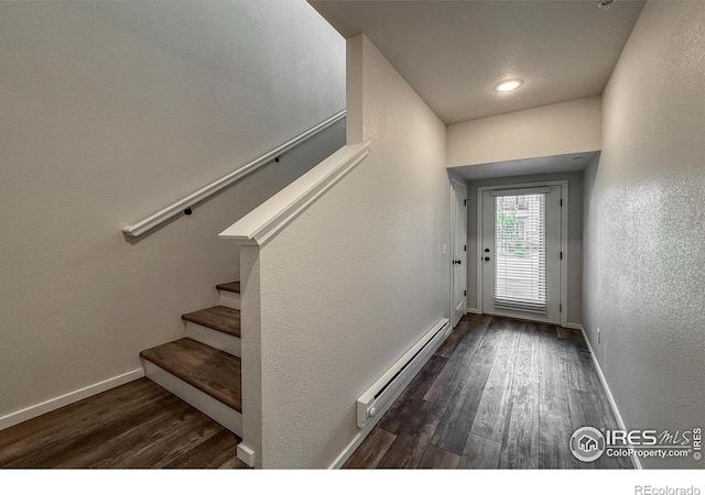 539 Vicot Way Unit C, Fort Collins, CO 80524 - doorway featuring a baseboard radiator, wood finished floors, stairs, and a textured wall