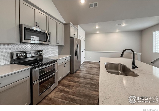 539 Vicot Way Unit C, Fort Collins, CO 80524 - kitchen with appliances with stainless steel finishes, gray cabinets, tasteful backsplash, recessed lighting, and dark wood finished floors