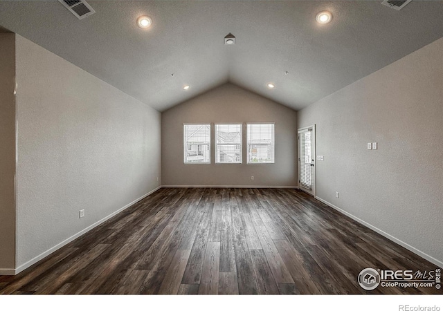 539 Vicot Way Unit C, Fort Collins, CO 80524 - unfurnished living room featuring lofted ceiling, dark wood-style flooring, a textured wall, and recessed lighting