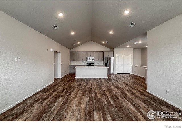 539 Vicot Way Unit C, Fort Collins, CO 80524 - unfurnished living room featuring lofted ceiling, dark wood finished floors, and recessed lighting