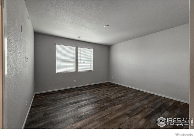 539 Vicot Way Unit C, Fort Collins, CO 80524 - empty room with dark wood-type flooring and a textured ceiling