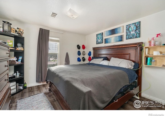 6743 King St, Denver, CO 80221 - bedroom with baseboards and wood finished floors