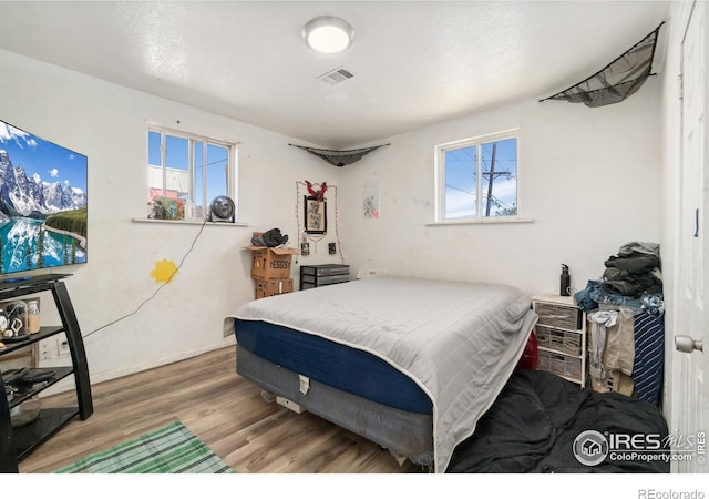 6743 King St, Denver, CO 80221 - bedroom featuring wood finished floors