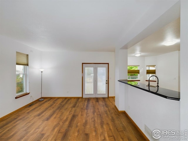 2720 E 121st Pl, Thornton, CO 80241 - unfurnished living room with wood finished floors and baseboards