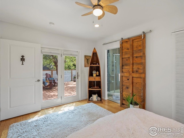 404 W Cleveland St, Lafayette, CO 80026 - bedroom featuring access to outside, wood finished floors, ensuite bath, a barn door, and recessed lighting