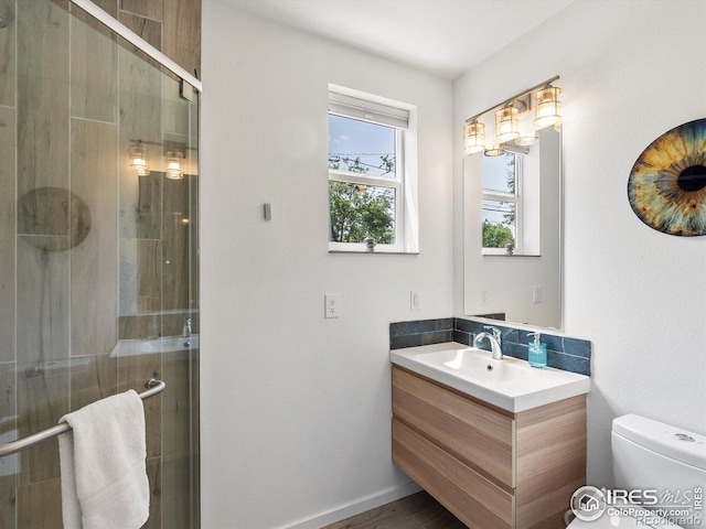 404 W Cleveland St, Lafayette, CO 80026 - bathroom featuring vanity, toilet, and a shower stall
