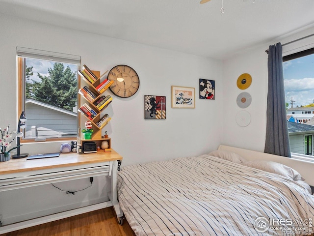 404 W Cleveland St, Lafayette, CO 80026 - bedroom featuring multiple windows and wood finished floors