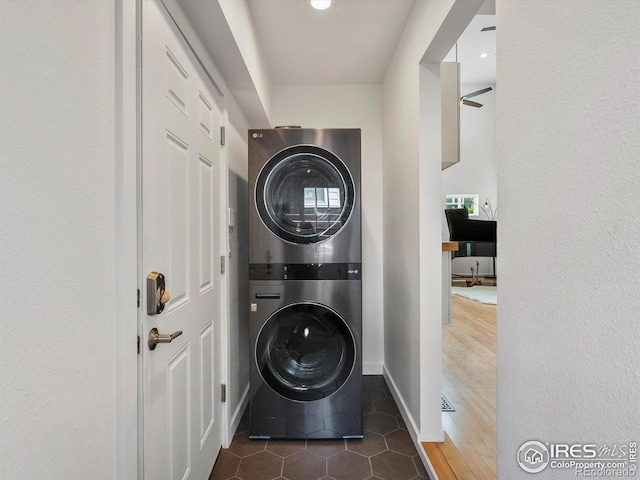 404 W Cleveland St, Lafayette, CO 80026 - washroom featuring estacked washer and dryer, baseboards, and tile patterned floors