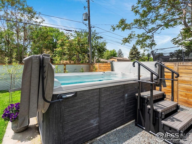 404 W Cleveland St, Lafayette, CO 80026 - view of swimming pool featuring a hot tub and a fenced backyard