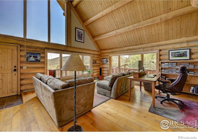 114 Jade Way, Lyons, CO 80540 - living area featuring rustic walls, high vaulted ceiling, an office area, wood-type flooring, and wooden ceiling with exposed beams