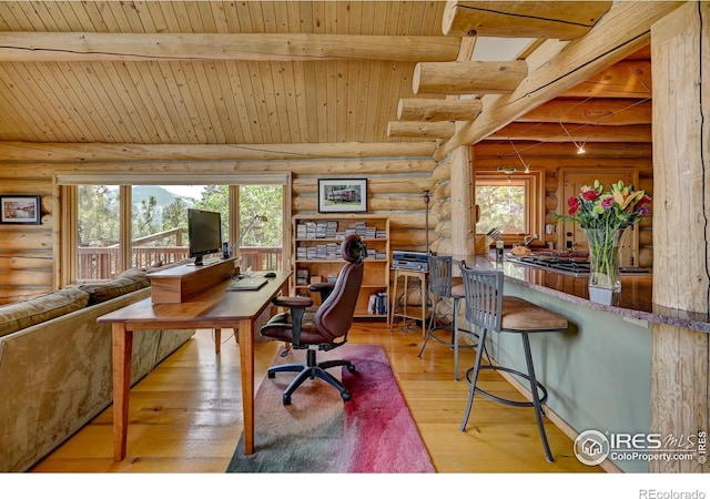 114 Jade Way, Lyons, CO 80540 - office area with rustic walls, wooden ceiling with exposed beams, and wood-type flooring