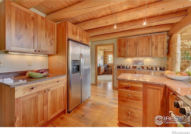 114 Jade Way, Lyons, CO 80540 - kitchen with stainless steel refrigerator with ice dispenser, light wood finished floors, wood ceiling with exposed beams, stone counters, and brown cabinetry