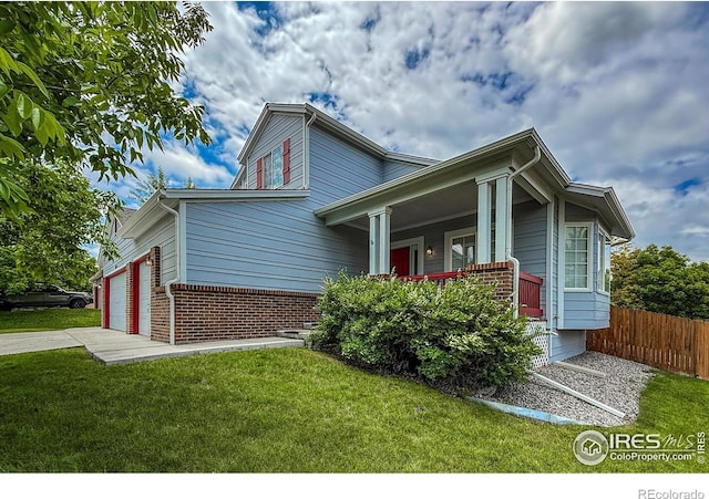 678 Mcclure Ct, Erie, CO 80516 - view of front facade featuring brick siding, covered porch, and concrete driveway